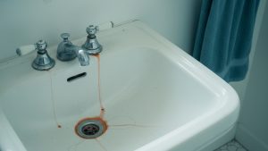 Orange iron staining in a sink caused by iron in well water
